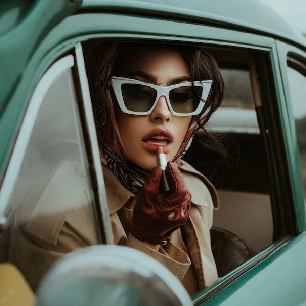 Woman with Lipstick Wearing Old Fashioned Clothing and Sunglasses